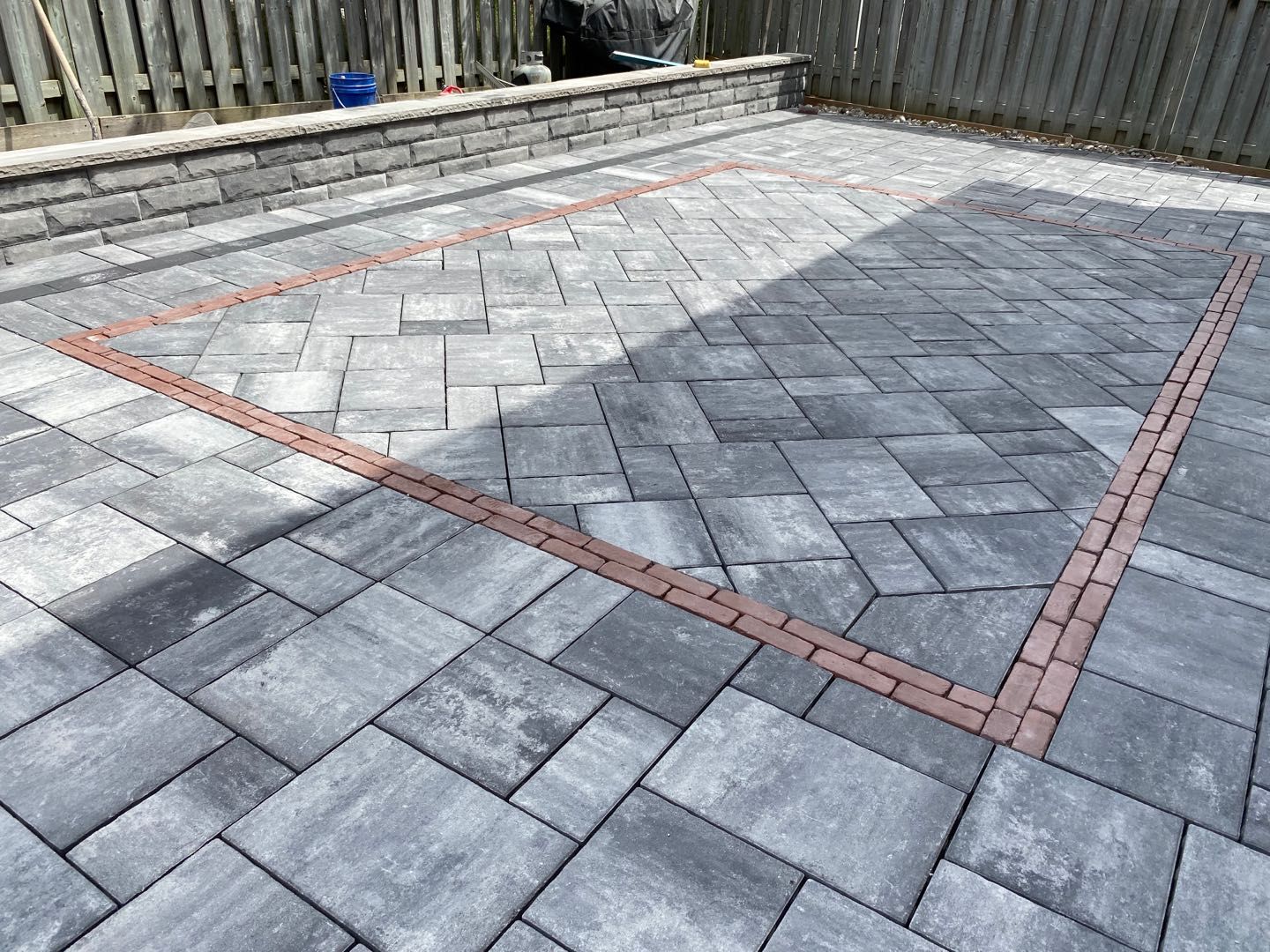 Decorative interlocking patio with border